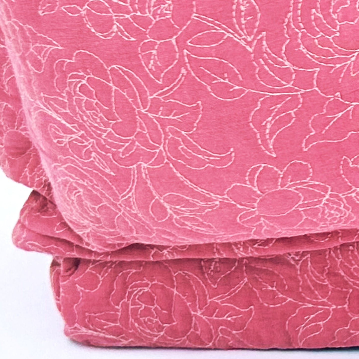Close-up of quilted embroidered fabric design on Petter World Imperial sofa bed