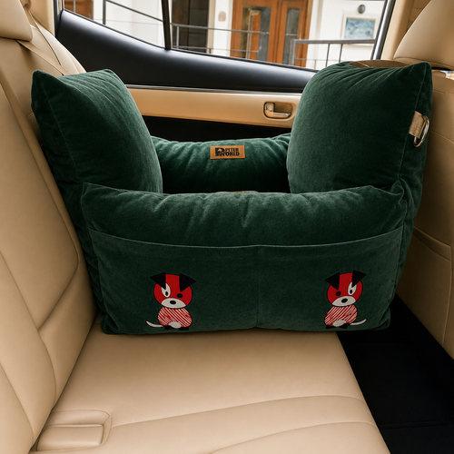 A dark green car seat pet booster cushion with two plush backrests and a front pocket, featuring embroidered cartoon dog graphics, shown installed in a beige leather car seat.